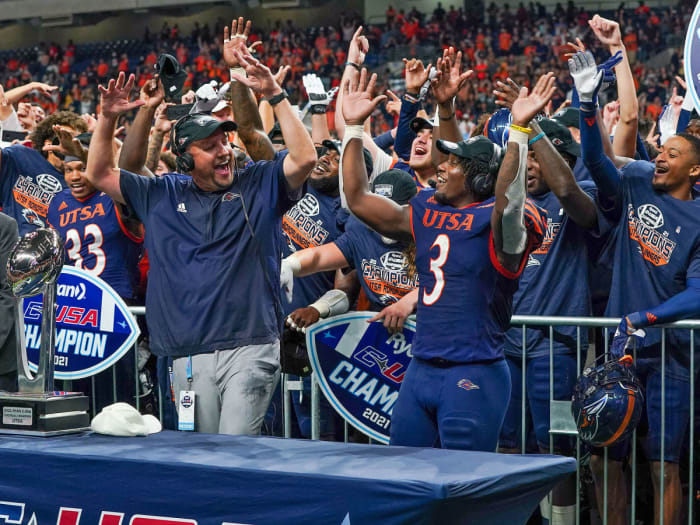 UTSA coach Jeff Traylor and his team celebrate their C-USA title